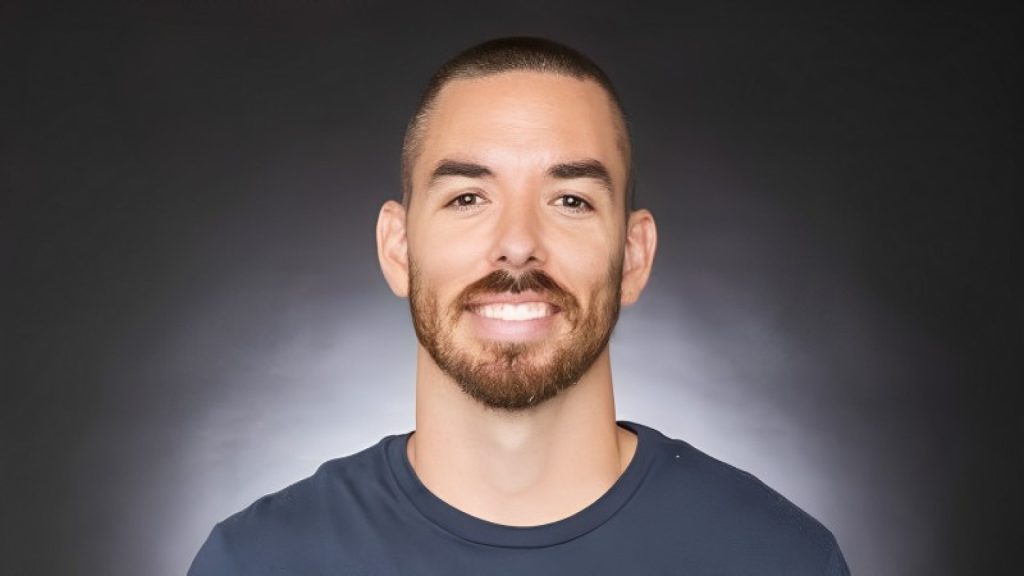 Riot Games Marc Merril smiling on white and grey background