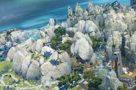 A vibrant landscape featuring large rocky formations, patches of greenery, and distant water, under a colorful sky.