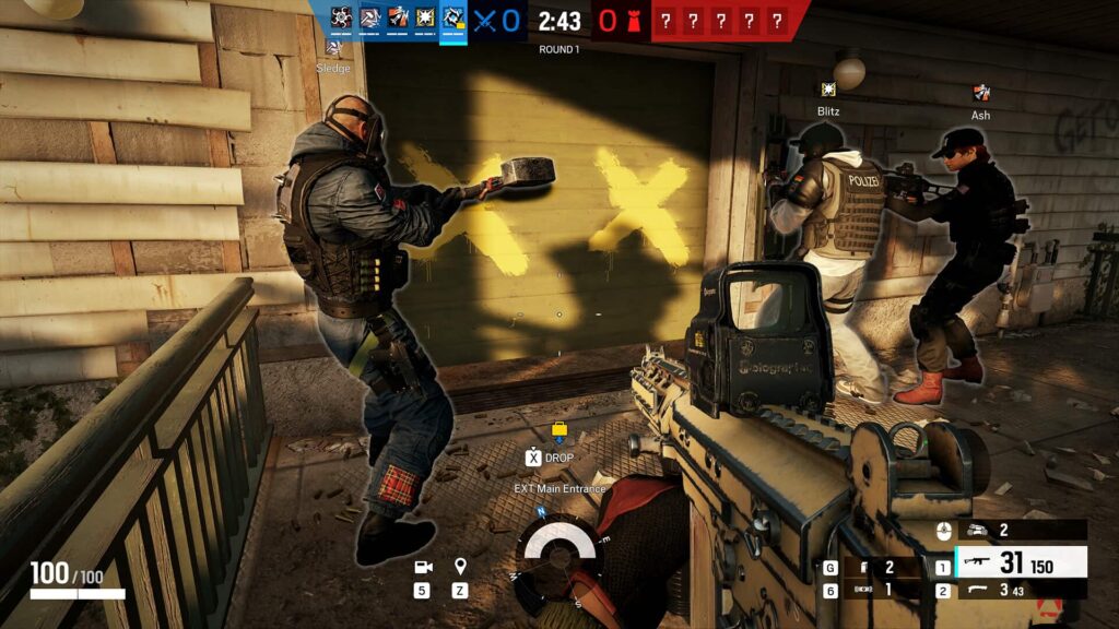 Two tactical operators preparing to breach a barricaded door marked with yellow "X" symbols; a weapon is prominently displayed in the foreground.