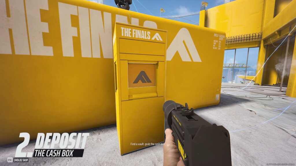 A hand holds a gun pointing at a yellow cash box with “THE FINALS” branding, set in a bright, industrial environment.