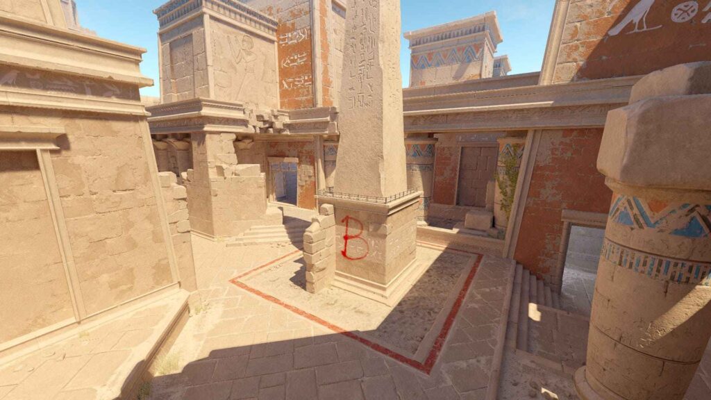 A sunlit ancient Egyptian temple courtyard featuring intricate hieroglyphs, a tall obelisk, and faded murals against sandy stone walls.