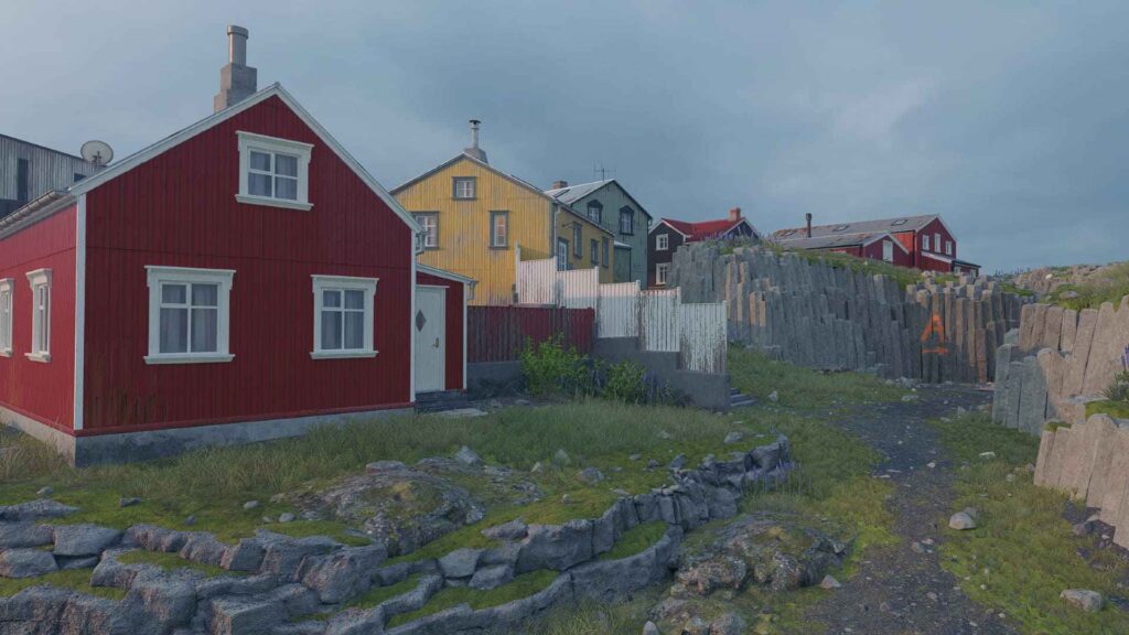 Colorful wooden houses nestled against rocky terrain, with green grass and a cloudy sky in the background.