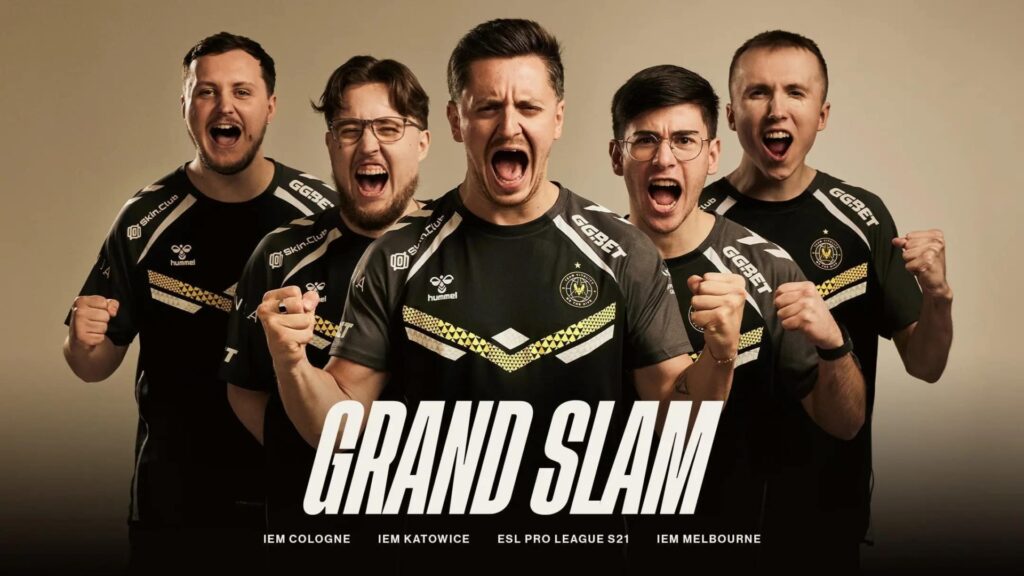 Team Vitality players celebrating their CS2 Intel Grand Slam victory, wearing matching jerseys and posing with triumphant expressions.