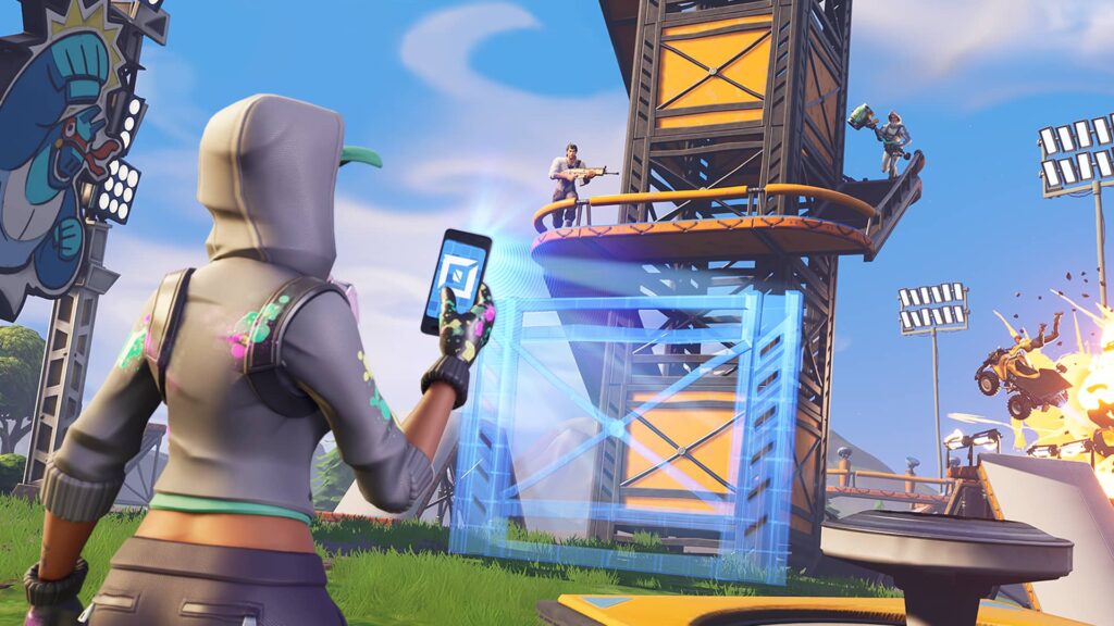 Fortnite character using a tablet to build a structure in Creative mode, with other players interacting on a custom map.