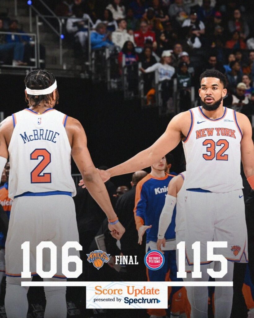 New York Knicks players McBride (#2) and Towns (#32) react after a 106–115 loss to the Detroit Pistons, as shown in the final score graphic during an NBA game.