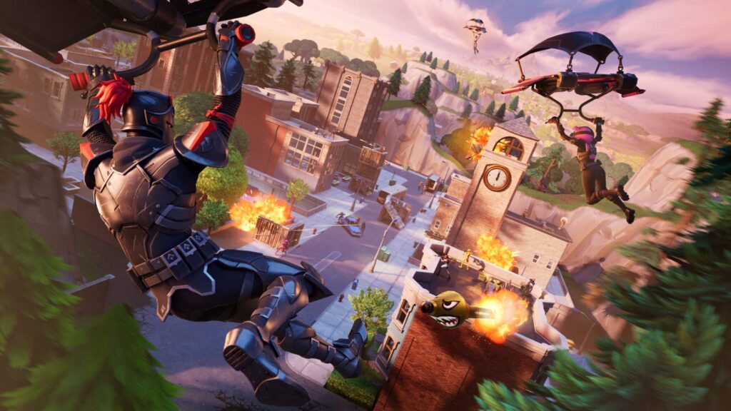 Fortnite characters glide into Tilted Towers while explosions erupt below, capturing the chaotic action of the OG Battle Royale map.