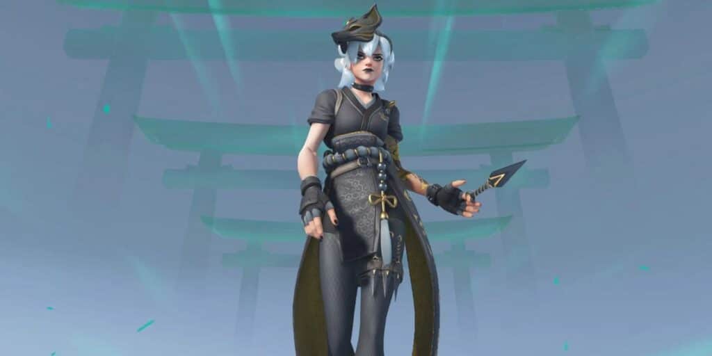 Kiriko dressed in dark, detailed attire with a flowing cape holds a throwing knife, set against a serene, misty background.