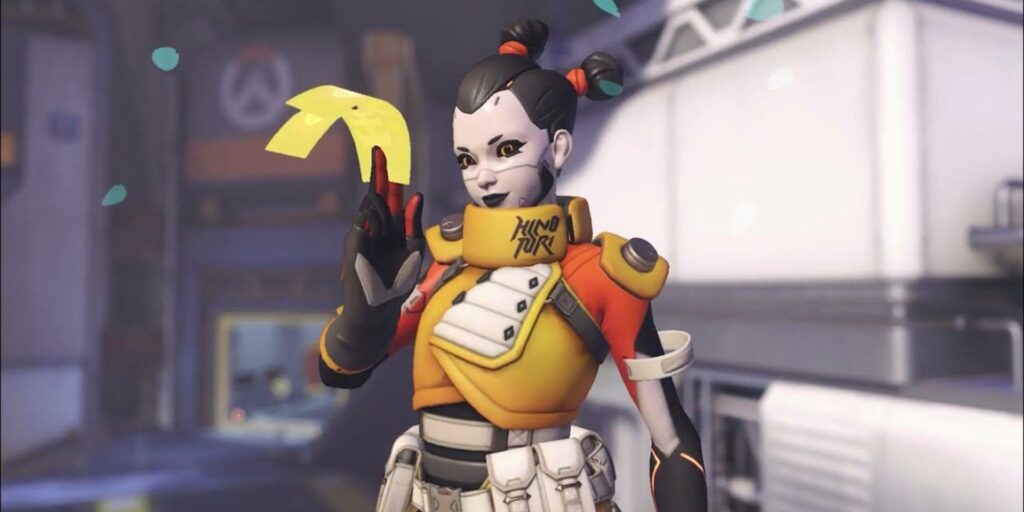 An Overwatch character in a colorful futuristic outfit holds a yellow object, surrounded by confetti in a stylized game environment.
