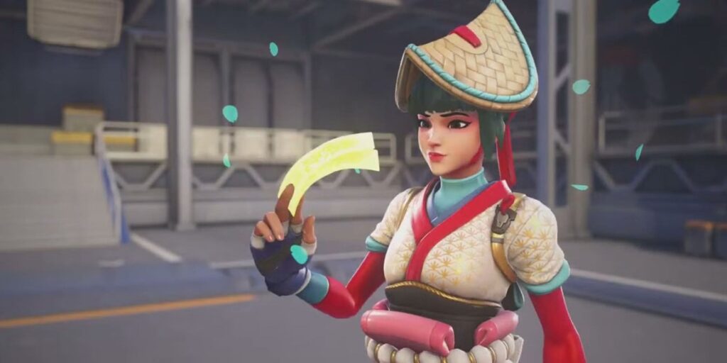 Kiriko in traditional attire holds a glowing yellow slice, adorned with colorful accents and a straw hat, set in a vibrant environment.