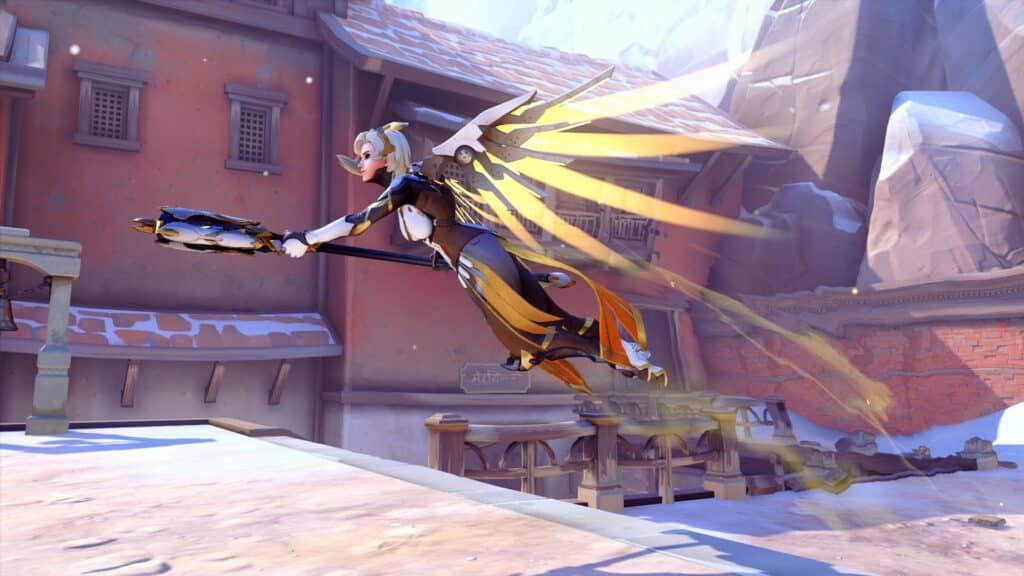 Overwatch 2’s Mercy uses Guardian Angel ability, flying forward with golden wings and staff in hand.