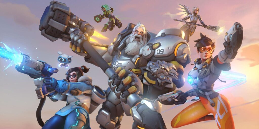 A group of futuristic characters from Overwatch 2 are posing dynamically with weapons, dressed in vibrant gear against a sunset backdrop.