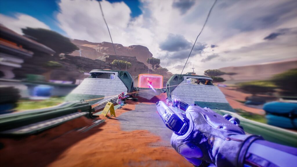 Splitgate gameplay showing a first-person view of a player shooting through a portal during a fast-paced battle on an outdoor map.