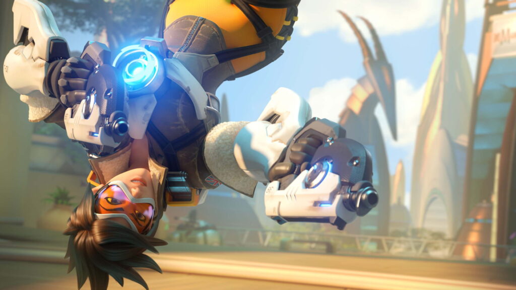Tracer from Overwatch mid-flip with dual pulse pistols aimed forward, glowing chronal accelerator on her chest, in a futuristic city backdrop.