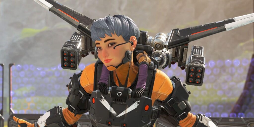 Valkyrie with jetpack gear and headset, smiling confidently in her orange suit in Apex Legends.