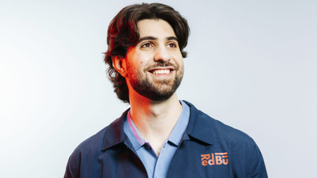 Image of SypherPK smiling while wearing Red Bull branded shirt