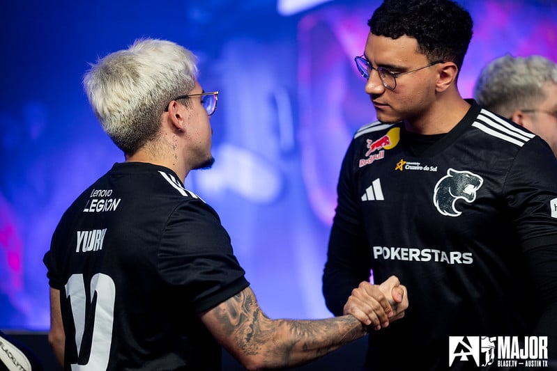 Two FURIA players shake hands after a match at the BLAST.tv Austin Major 2025
