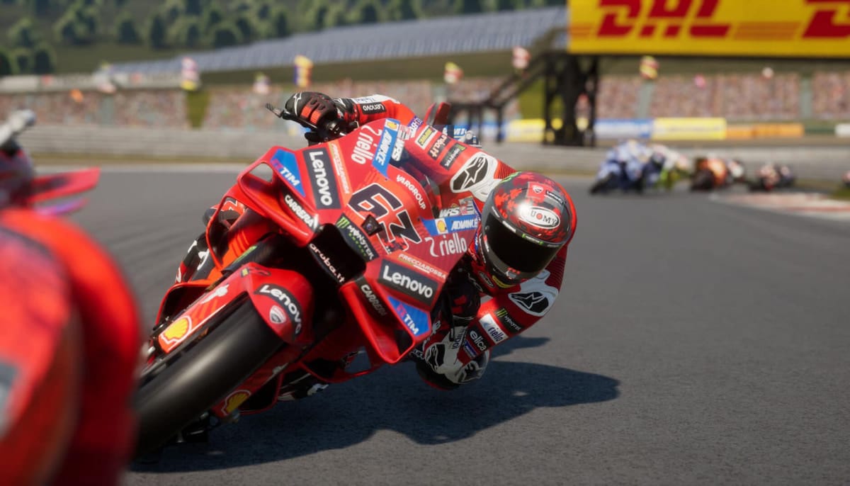 Close-up of a Ducati rider leaning into a corner during a MotoGP 25 race simulation