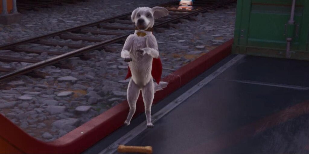 Krypto the Superdog standing upright near train tracks in Fortnite, wearing a red cape, with a bone-shaped Krypto Treat lying on the ground nearby