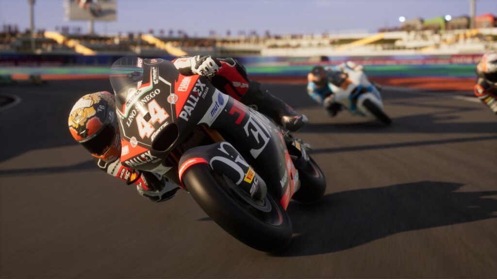 Close-up of a rider in MotoGP 25 leaning into a turn during a high-speed race