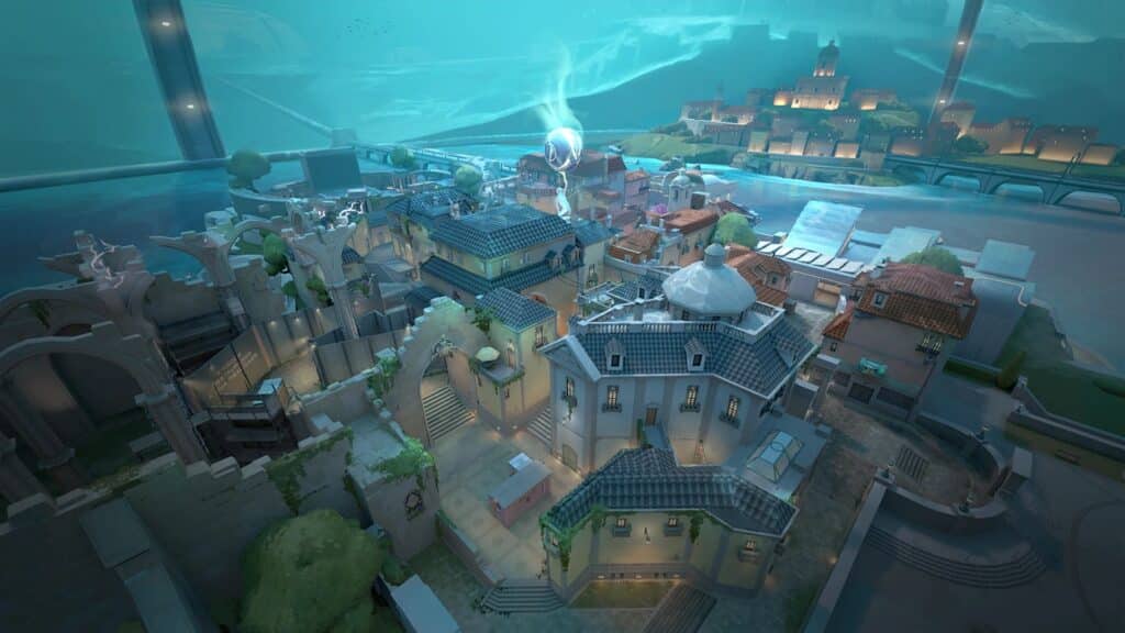 Aerial view of a vibrant, medieval-style cityscape of a Pearl map of VALORANT with lush greenery and detailed architecture under a teal sky.