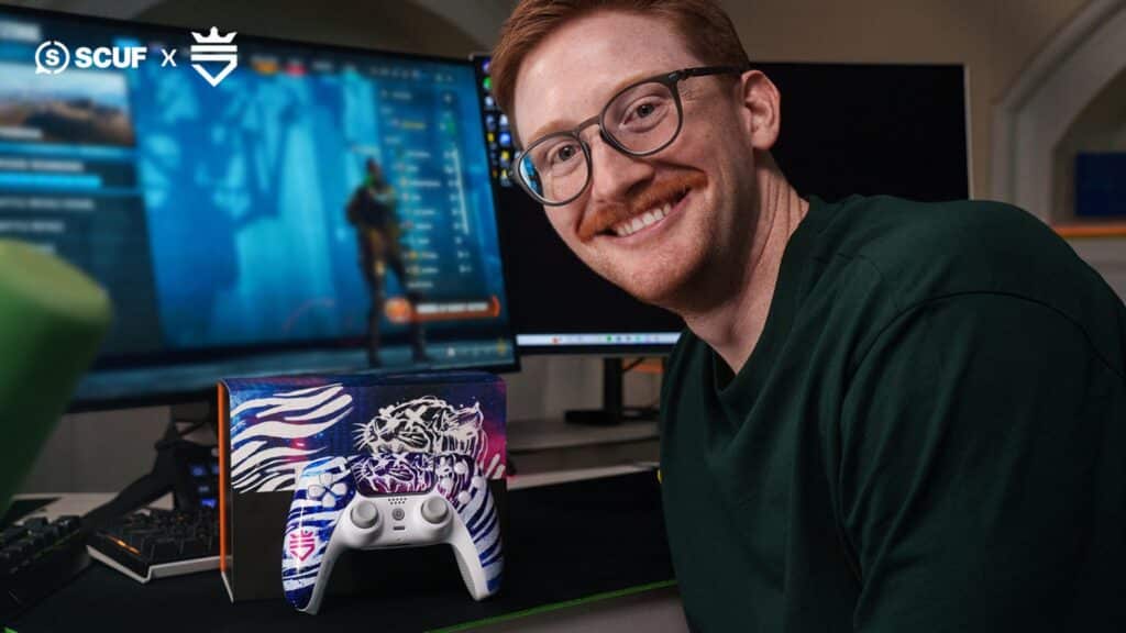 Image of Scump smiling next to a SCUF controller placed next to box