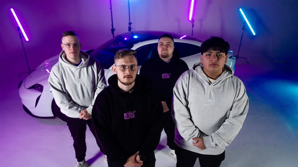 Image of Toronto Ultra team wearing branded hoodies while standing in front of car