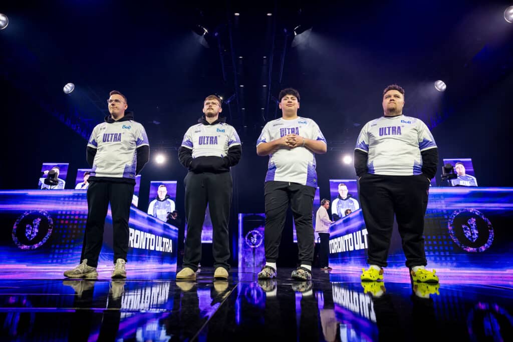 Image of Toronto Ultra players standing on CDL stage lit up in purple lighting