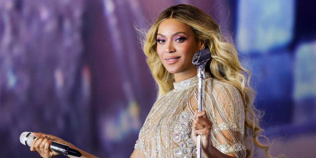 Beyonce  holds a microphone on stage