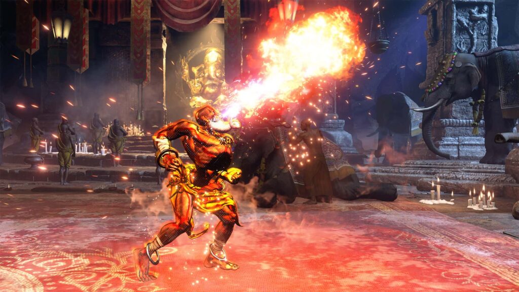 Dhalsim unleashes a blast of flames in an ornate temple, with monks and elephants in the background