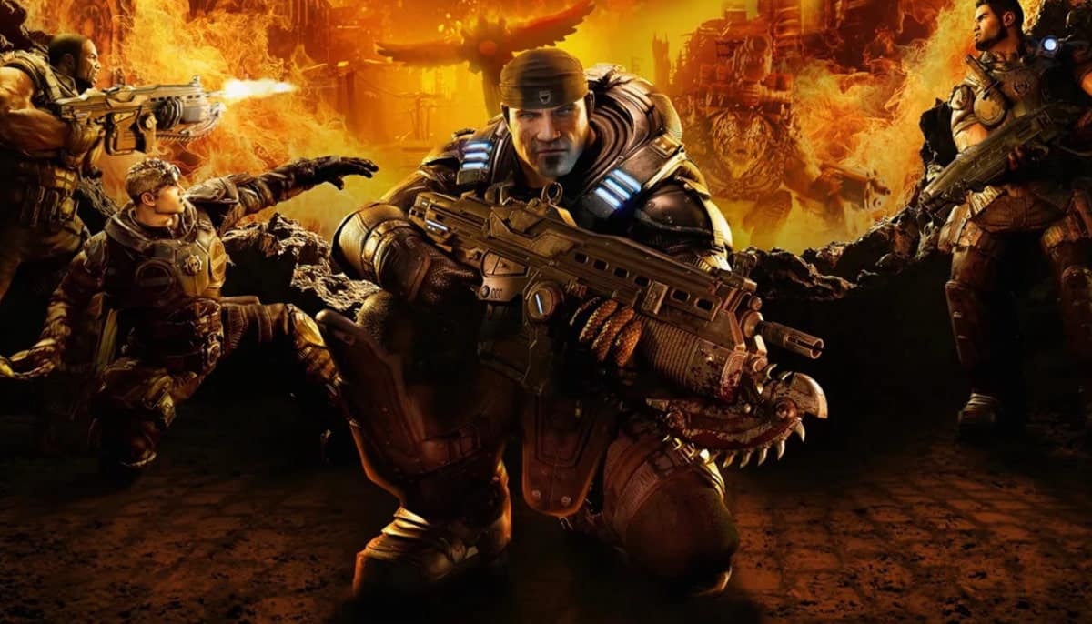 Kneeling warrior in futuristic armor holds a rifle, surrounded by armed comrades. The scene from Gears of War