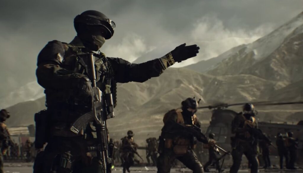 A soldier from Battlefield 6 in tactical gear gestures while a team prepares for action in a dramatic mountainous landscape.