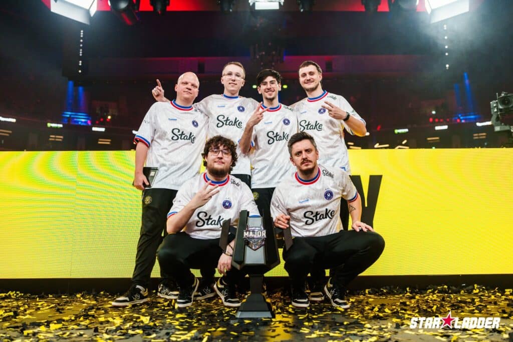 Image of Team Vitality Counter-Strike team posing on stage with Budapest Major trophy