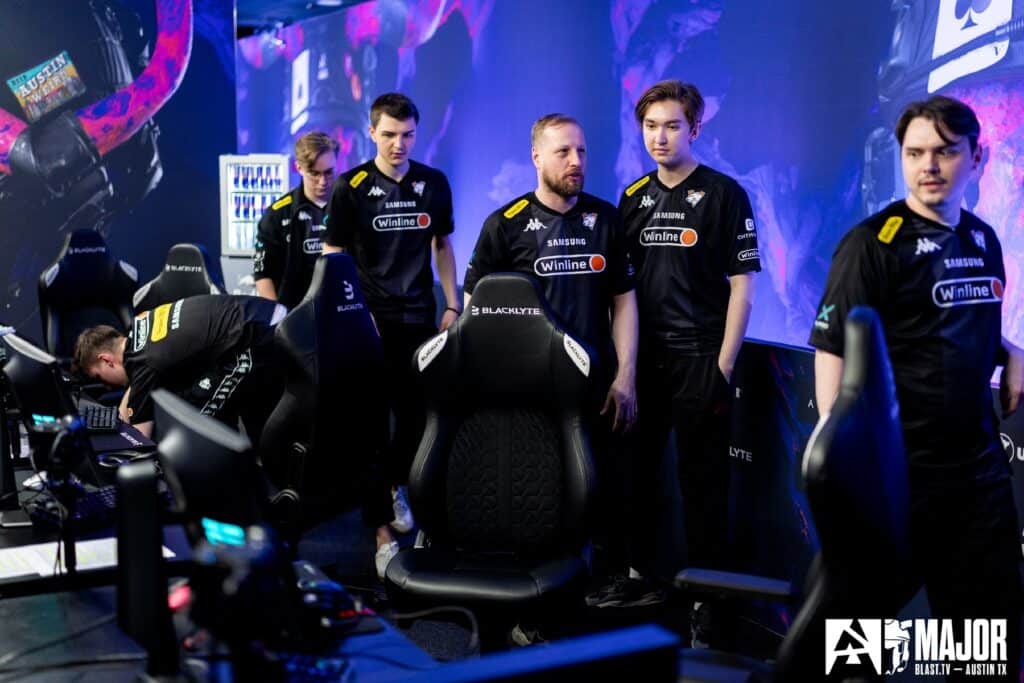 Image of Virtus.pro Counter-Strike roster standing up next to esports stage at BLAST Austin Major