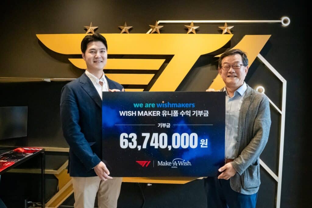 T1 and Make a Wish members holding check