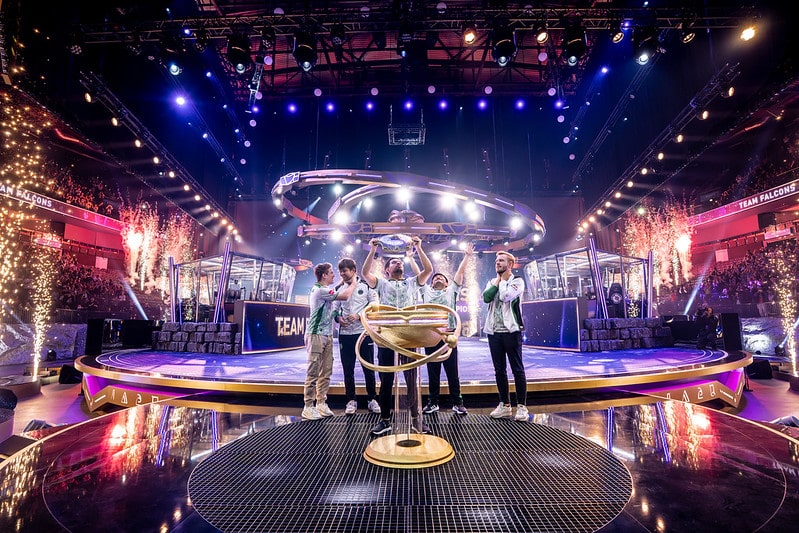 Team Falcons hoisting the trophy at The Internationals 2025 Dota 2 event in Barclays Arena, Hamburg, Germany.