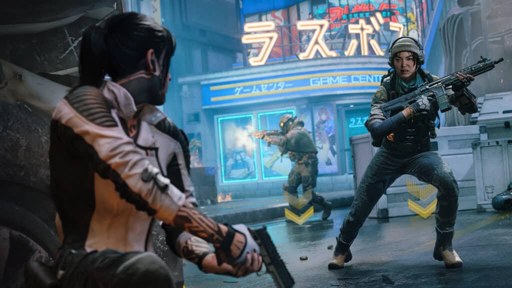 Image of Call of Duty Black Ops 7 players holding weapons. A player in the background is firing a weapon while controlling a Hardpoint hill indicated by yellow arrows on the ground
