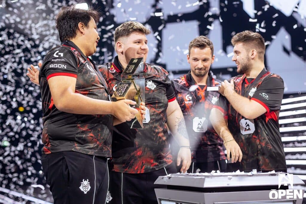 G2 Esports lifting BLAST Open London trophy while standing on stage ahead of FISSURE Playground 2