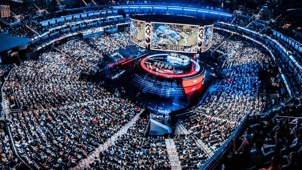 Image of League of Legends World Championship stage in centre of stadium with a crowd surrounding it
