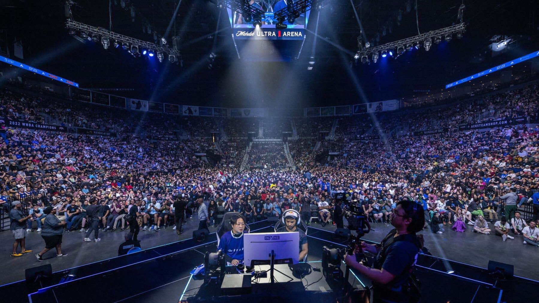 Image of Evo esports event with two players competing on stage in front of a large crowd