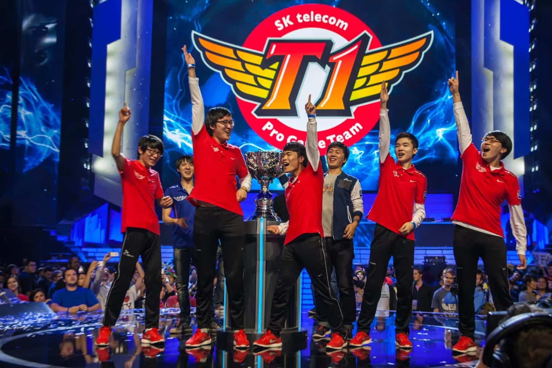 The SK Telecom T1 on a stage with trophy
