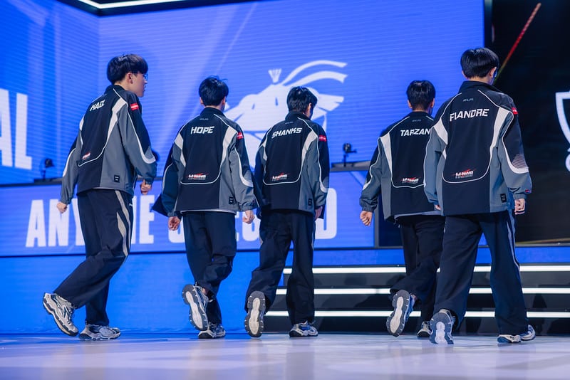 Anyone’s Legend team walks onto the League of Legends Worlds 2025 stage
