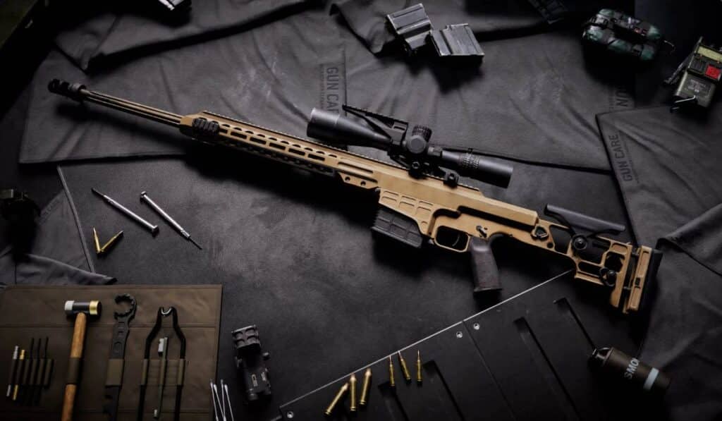 Close-up of a Battlefield 6 sniper rifle laid on a workbench with ammunition and tools, representing the Engineer and Support loadouts.