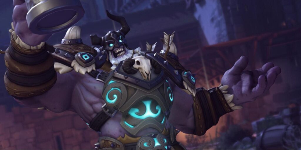 Draugr Reinhardt hebt einen Krug und gestikuliert mit der anderen Hand