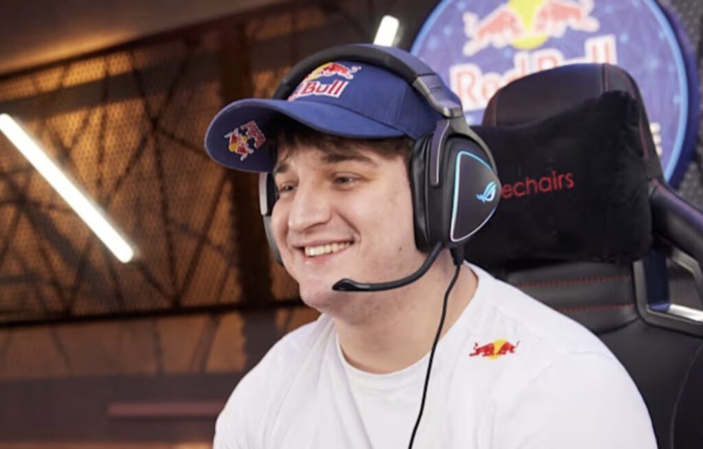 Jukeyz smiles while gaming with a headset and Red Bull cap during a Call of Duty: Black Ops 7 session