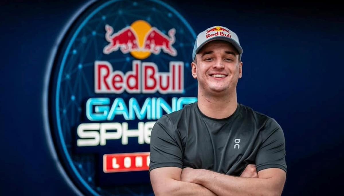 Jukeyz smiles in front of the Red Bull Gaming Sphere logo, representing his partnership and motivation in Call of Duty: Black Ops 7