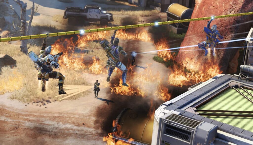 hree armored characters zip-line above a fiery battlefield in Apex Legends