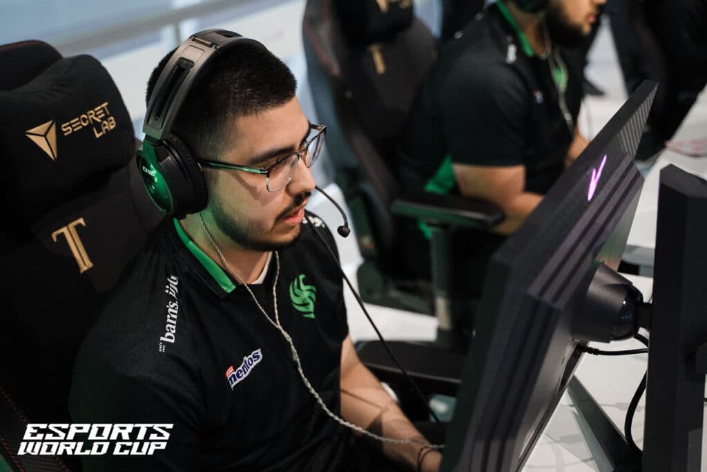 Image of Call of Duty Warzone player Shifty competing at Esports World Cup 2024. The player is wearing a headset and a black Team Falcons jersey