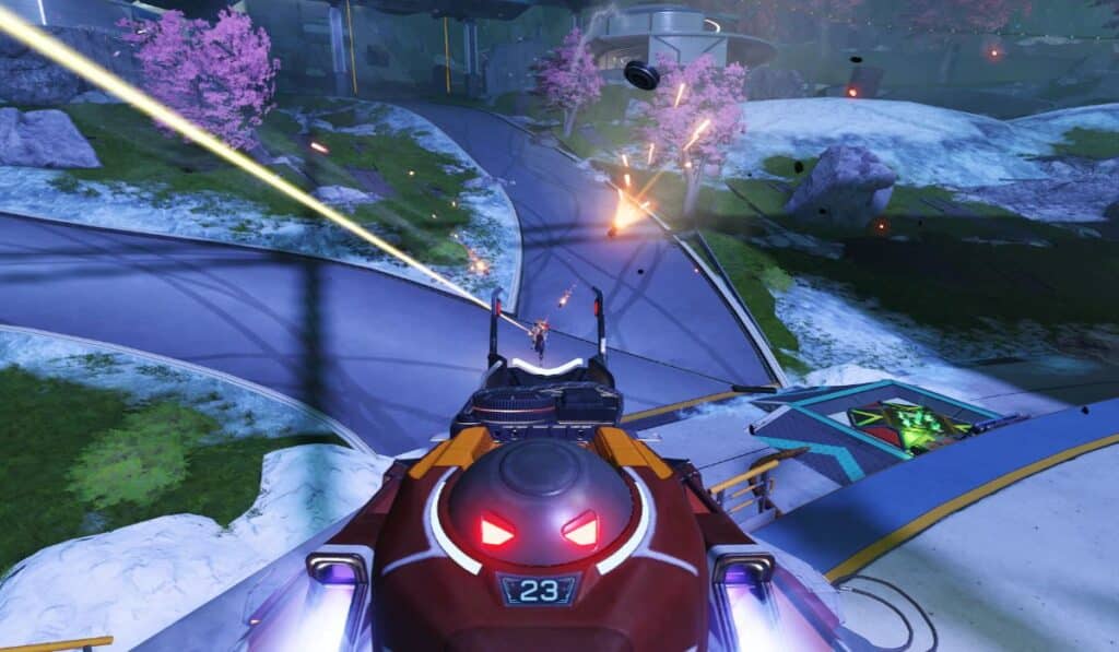 In Apex Legends feuert ein futuristisches Fahrzeug in einer lebendigen Landschaft mit Kirschblüten auf entfernte Ziele