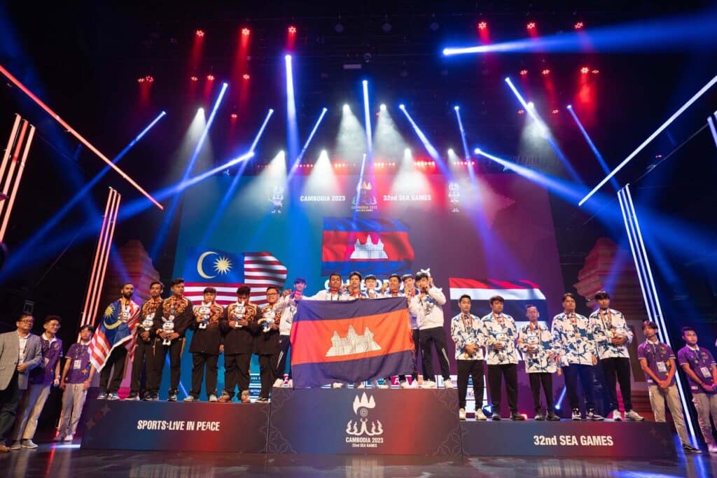 Image of SEA Games 2023 medal podium with esports players standing on it