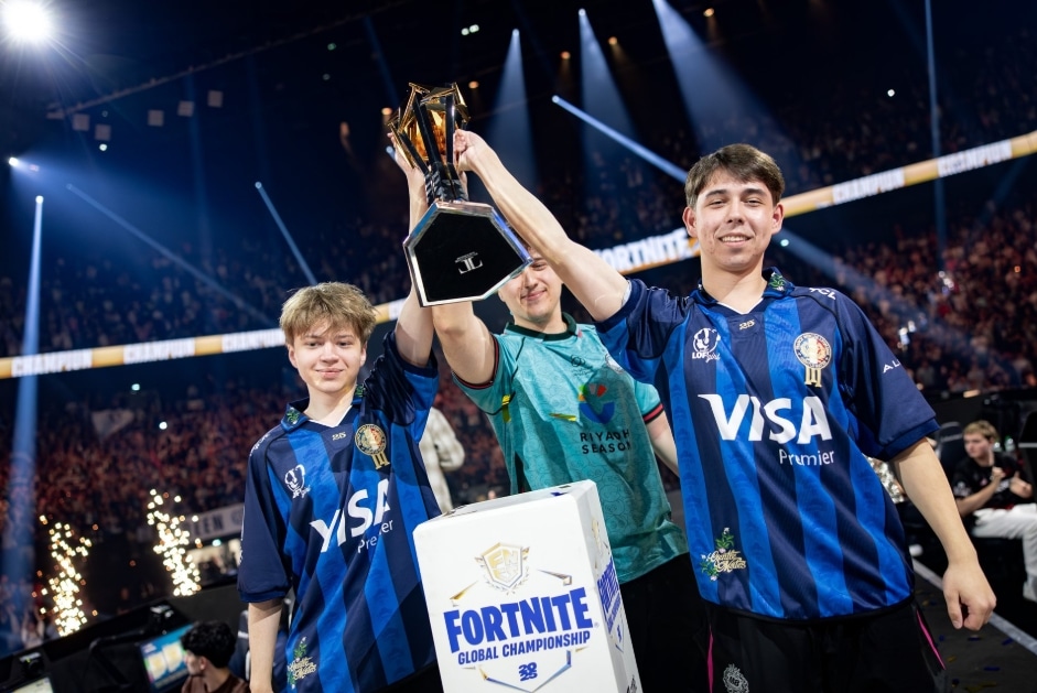 FNCS 2025 Global Championship winning trio hoisting the trophy after Grand Finals in France